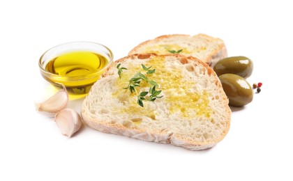 Tasty bruschettas with oil, garlic and olives on white background