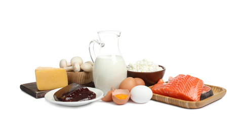 Photo of Fresh products rich in vitamin D on white background