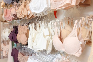 Many different beautiful women's underwear in lingerie store, closeup