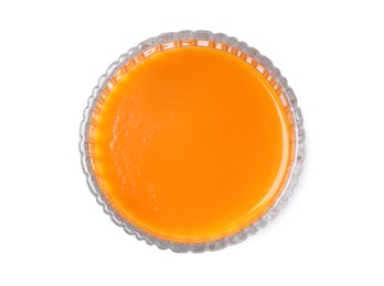 Photo of Tasty fresh carrot juice in glass isolated on white, top view