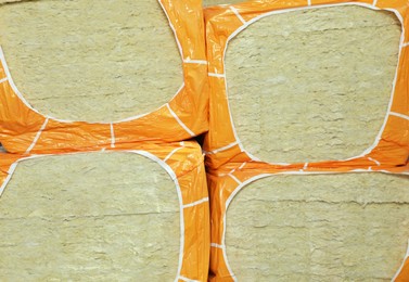 Packages of thermal insulation material as background