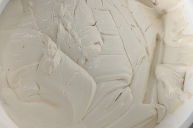 Texture of plaster in bucket, top view