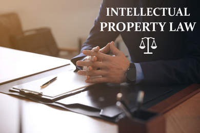 Intellectual property law. Jurist at table in office, closeup