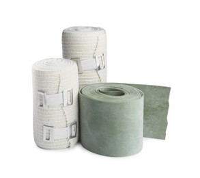 Medical bandage rolls on white background. First aid items
