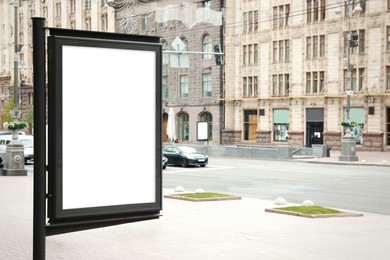 Blank advertising board on city street. Space for design