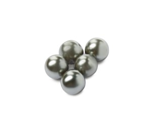 Many beautiful black oyster pearls on white background