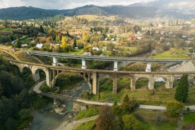 Aerial view of bridges and village on autumn day