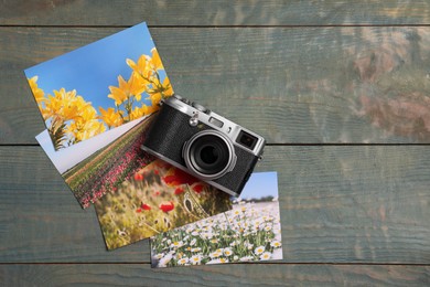 Photo of Vintage photo camera and beautiful printed pictures on wooden table, flat lay with space for text. Creative hobby