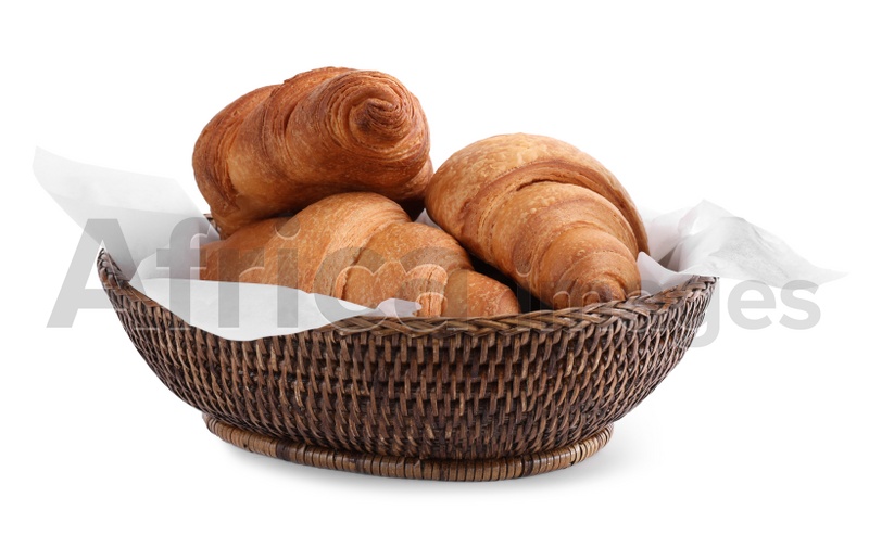 Tasty croissants in wicker bowl isolated on white
