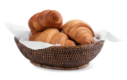 Tasty croissants in wicker bowl isolated on white