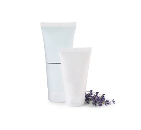 Tubes of hand cream and lavender on white isolated