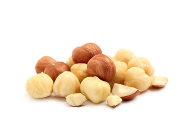 Heap of tasty hazelnuts on white background