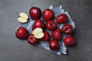 Photo of Fresh ripe red apples on grey table, flat lay