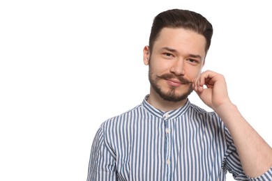 Photo of Smiling man in striped shirt touching mustache on white background