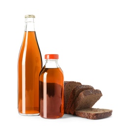Photo of Bottles of delicious fresh kvass and bread isolated on white