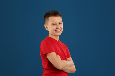 Portrait of preteen boy on blue background
