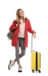 Woman with suitcase on white background. Winter travel