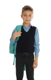 Little boy in school uniform with backpack on white background