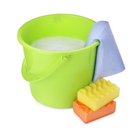 Green bucket with detergent, rag and sponges on white background