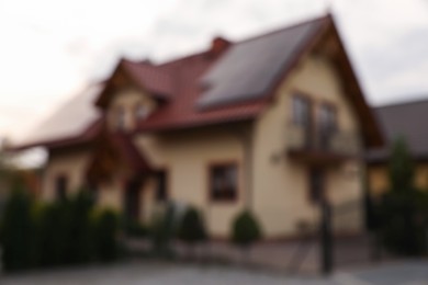 Photo of Beautiful house near fence outdoors, blurred view. Real estate for rent