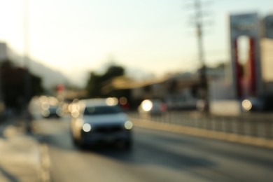 Blurred view of road with cars, bokeh effect