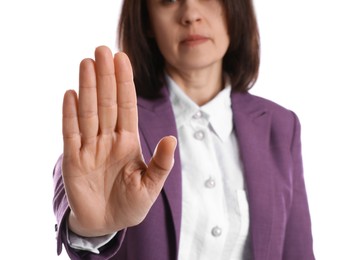 Woman in suit showing gesture stop on white background, closeup