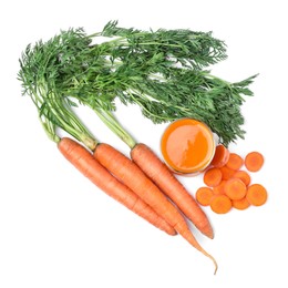 Photo of Freshly made carrot juice in glass isolated on white, top view