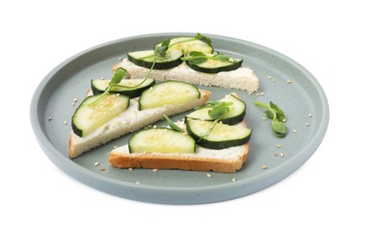 Tasty cucumber sandwiches with sesame seeds and pea microgreens on white background