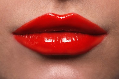 Young woman with beautiful red lips, closeup