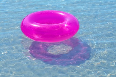 Bright inflatable ring floating on sea water