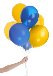 Woman holding many balloons in colors of Ukrainian flag on white background, closeup