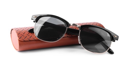 Photo of Stylish sunglasses and brown leather case on white background