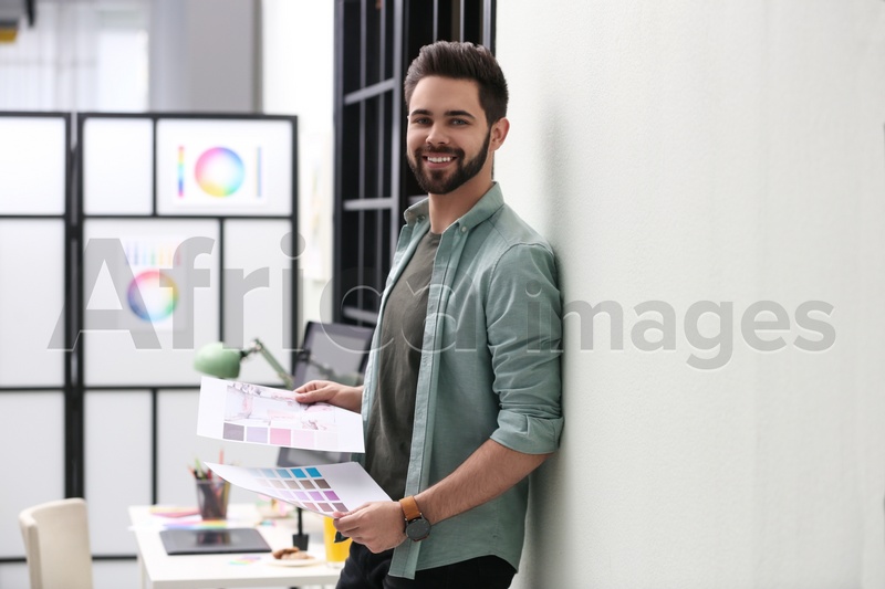 Photo of Portrait of male designer in office. Creative profession