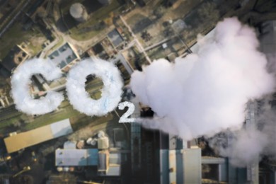 Inscription CO2 made of smoke. Aerial view of industrial factory