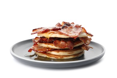 Delicious pancakes with maple syrup and fried bacon on white background