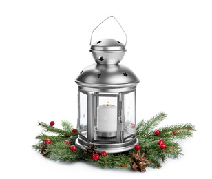 Decorative Christmas lantern and coniferous twigs on white background