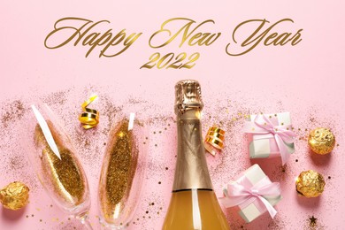 Happy New 2022 Year! Flat lay composition with bottle of sparkling wine on pink background