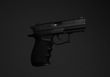 Standard handgun on dark background. Semi-automatic pistol