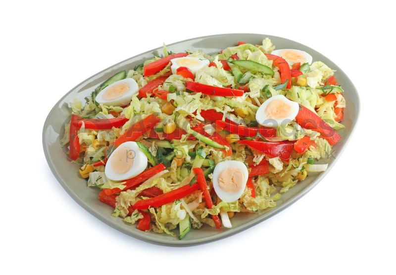 Plate of delicious salad with Chinese cabbage and quail eggs isolated on white