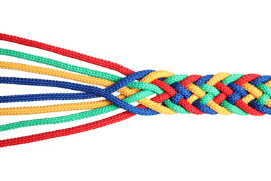 Braided colorful ropes isolated on white, top view. Unity concept