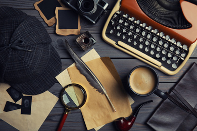 Flat lay composition with vintage detective items on grey wooden background