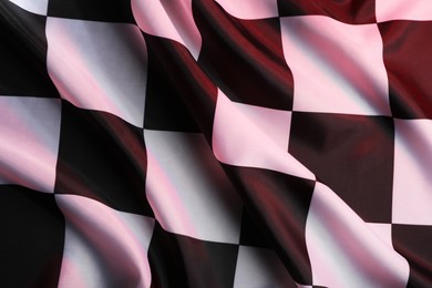 Racing checkered flag as background, top view