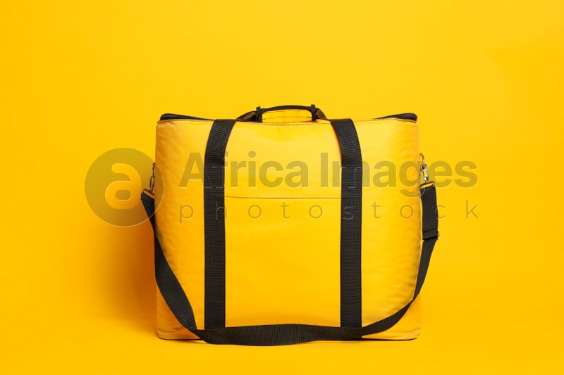 Modern large thermo bag on yellow background