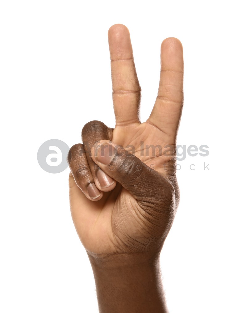 Photo of African-American man showing PEACE sign on white background, closeup