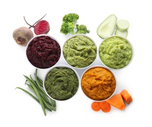 Different delicious puree in bowls and fresh ingredients on white background, top view. Healthy food