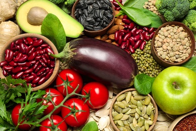 Different vegetables, seeds and fruits as background, closeup. Healthy diet