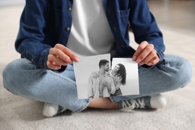 Image of Divorce and breakup. Woman ripping black and white photo at home, closeup