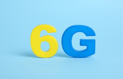 6G symbol on light blue background. Modern technologies