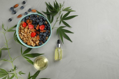 CBD oil, THC tincture, oatmeal bowl and hemp leaves on light grey table, flat lay. Space for text