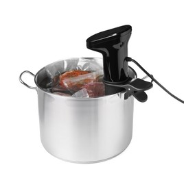 Thermal immersion circulator and meat in pot on white background. Vacuum packing for sous vide cooking